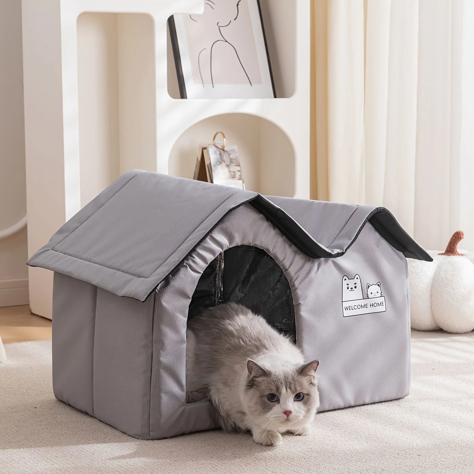 Comfortable winter cat shelter placed indoors, providing a warm resting space for cats.